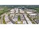 Aerial view of community with tree-lined streets, and commercial areas amongst lush green surroundings at 102 Grand Cres, Alpharetta, GA 30009