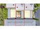 Aerial view of condo building reveals a central courtyard with outdoor seating and a cozy fire pit feature at 102 Grand Cres, Alpharetta, GA 30009