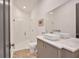 Modern bathroom with a glass-enclosed shower, sleek vanity, and stylish herringbone flooring at 102 Grand Cres, Alpharetta, GA 30009