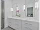 Modern bathroom boasts marble countertops, double sinks, and stainless steel fixtures at 102 Grand Cres, Alpharetta, GA 30009