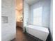 Bright bathroom shows walk-in shower and free standing tub at 102 Grand Cres, Alpharetta, GA 30009
