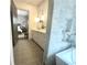 Well lit bathroom shows easy access to the bedroom from within the walk-in shower at 102 Grand Cres, Alpharetta, GA 30009