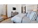 Relaxing bedroom features a ceiling mounted television and easy access to other areas of the home at 102 Grand Cres, Alpharetta, GA 30009
