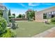 Open-air community space with manicured artificial lawn, comfortable seating, and mature landscaping at 102 Grand Cres, Alpharetta, GA 30009