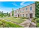 Stately brick building boasts refined architectural details, complemented by lush landscaping and manicured lawn at 102 Grand Cres, Alpharetta, GA 30009
