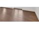 A stunning hardwood floor adds character and warmth to the home with white trim at 102 Grand Cres, Alpharetta, GA 30009