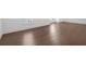 A stunning hardwood floor adds character and warmth to the home with white trim at 102 Grand Cres, Alpharetta, GA 30009