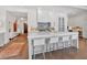 Modern kitchen featuring white cabinets, marble countertops, and eat-in island at 102 Grand Cres, Alpharetta, GA 30009