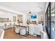 Bright, open-concept kitchen and living area with sleek design and modern appliances at 102 Grand Cres, Alpharetta, GA 30009