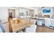 Bright, open-concept kitchen and living area with sleek design and modern appliances at 102 Grand Cres, Alpharetta, GA 30009
