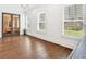 Bright living room with hardwood floors, plantation shutters, and modern light fixtures at 102 Grand Cres, Alpharetta, GA 30009