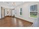Living room showcasing hardwood floors, plantation shutters, and modern light fixtures at 102 Grand Cres, Alpharetta, GA 30009