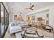 Open living area with hardwood floors, modern decor, and a view of the kitchen at 102 Grand Cres, Alpharetta, GA 30009