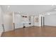 Spacious living space with wood floors and a kitchenette with modern appliances at 102 Grand Cres, Alpharetta, GA 30009