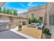 A beautiful outdoor patio featuring a built-in grill, modern fire pit, and comfortable seating at 102 Grand Cres, Alpharetta, GA 30009