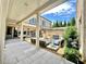 Elegant outdoor patio featuring a fire pit, seating, and a grill for outdoor entertaining at 102 Grand Cres, Alpharetta, GA 30009
