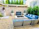 Inviting outdoor patio features a modern fire pit, water feature, and comfortable seating, creating an ideal space for relaxation at 102 Grand Cres, Alpharetta, GA 30009