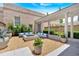 Charming outdoor patio with a fire pit, comfortable seating, and lush landscaping for relaxation at 102 Grand Cres, Alpharetta, GA 30009