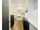 Spacious walk-in closet with custom shelving and drawers offers ample storage space at 102 Grand Cres, Alpharetta, GA 30009