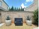 A modern water feature is the focal point of this backyard oasis, creating a serene and stylish outdoor space at 102 Grand Cres, Alpharetta, GA 30009