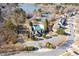 Aerial view of the property with pool, tennis courts, and surrounding landscape at 1301 Dayspring Trce, Lawrenceville, GA 30045