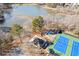 Aerial shot showcasing tennis courts, playground, and lake in the community at 1301 Dayspring Trce, Lawrenceville, GA 30045