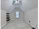 Finished attic featuring bright white walls, plush carpet, standard window, and overhead lighting at 1301 Dayspring Trce, Lawrenceville, GA 30045