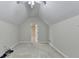 Finished attic featuring bright white walls, plush carpet, open door and overhead lighting at 1301 Dayspring Trce, Lawrenceville, GA 30045