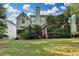 An exterior view from the lawn showing the back of the house at 1301 Dayspring Trce, Lawrenceville, GA 30045