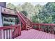Wooden deck with multiple levels and greenery at 1301 Dayspring Trce, Lawrenceville, GA 30045