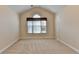 Bedroom featuring vaulted ceilings, plush carpet, and a large window with natural light at 1301 Dayspring Trce, Lawrenceville, GA 30045
