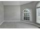 Bedroom featuring a dome ceiling, natural light, and neutral color palette at 1301 Dayspring Trce, Lawrenceville, GA 30045
