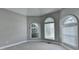 Bedroom with a dome ceiling and large windows with natural light, perfect for relaxation at 1301 Dayspring Trce, Lawrenceville, GA 30045