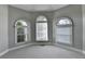 Bedroom featuring a dome ceiling, natural light, and neutral color palette at 1301 Dayspring Trce, Lawrenceville, GA 30045