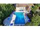 An aerial view of a large community pool surrounded by lounge chairs and umbrellas at 1301 Dayspring Trce, Lawrenceville, GA 30045