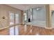 View from bright eat-in kitchen to deck and living room with fireplace and staircase at 1301 Dayspring Trce, Lawrenceville, GA 30045