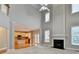 Spacious living room with fireplace and seamless transition to the modern kitchen area at 1301 Dayspring Trce, Lawrenceville, GA 30045