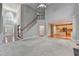 Open concept living room leading to the kitchen, with a staircase and high ceilings, creating a welcoming atmosphere at 1301 Dayspring Trce, Lawrenceville, GA 30045