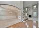 Open-concept living space featuring a chandelier, wainscoting, and an elegant archway at 1301 Dayspring Trce, Lawrenceville, GA 30045