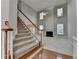 Open-concept living room with high ceilings, large windows, and a cozy fireplace at 1301 Dayspring Trce, Lawrenceville, GA 30045