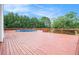 Spacious wooden deck featuring an above ground pool, perfect for outdoor entertaining at 215 Nina Circle Cir, Locust Grove, GA 30248