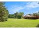 Expansive backyard with a large wooden deck at 215 Nina Circle Cir, Locust Grove, GA 30248