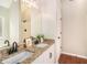 Bathroom with a double sink vanity, granite countertop, and sleek fixtures at 215 Nina Circle Cir, Locust Grove, GA 30248