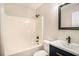 Bright bathroom featuring a tub-shower combination, modern vanity, and a framed mirror at 215 Nina Circle Cir, Locust Grove, GA 30248