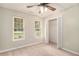 Neutral bedroom with a window view, closet, and ceiling fan at 215 Nina Circle Cir, Locust Grove, GA 30248