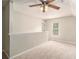 Spacious bonus room or loft area featuring soft carpeting, neutral paint, and a ceiling fan at 215 Nina Circle Cir, Locust Grove, GA 30248