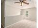 Spacious bonus room with soft carpet and a modern ceiling fan at 215 Nina Circle Cir, Locust Grove, GA 30248