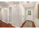 Bright entryway featuring hardwood floors, neutral walls, and a welcoming front door with glass detailing at 215 Nina Circle Cir, Locust Grove, GA 30248