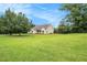 Expansive lawn surrounds this lovely home with mature trees providing lots of shade at 215 Nina Circle Cir, Locust Grove, GA 30248