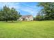 Expansive green lawn surrounds this charming home, offering plenty of outdoor space and privacy at 215 Nina Circle Cir, Locust Grove, GA 30248